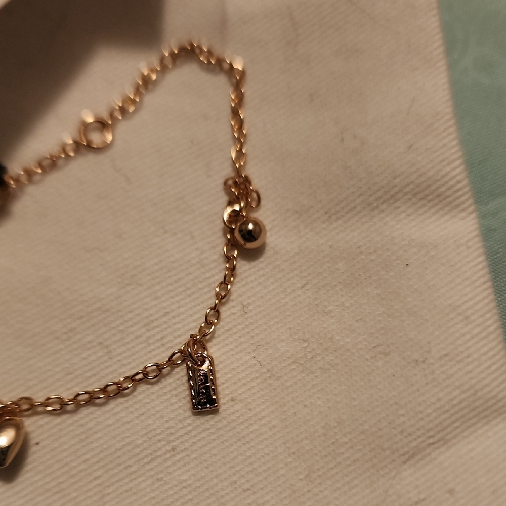 Coach Gold-Tone Delicate Charm Bracelet - Picture 7 of 7